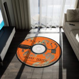Half-Life round rug with original 1998 orange CD-ROM design and lambda logo
