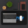 Aperture Laboratories blue logo black desk mat - overhead desk view with a laptop and mouse Black Portal desk mat with a large blue Aperture Laboratories logo, overhead desk view with a laptop and mouse
