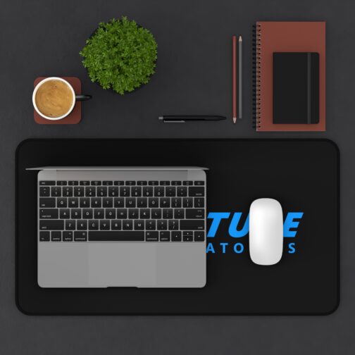 Aperture Laboratories blue logo black desk mat - overhead desk view with a laptop and mouse Black Portal desk mat with a large blue Aperture Laboratories logo, overhead desk view with a laptop and mouse