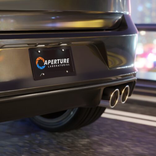aperture-laboratories-decorative-vanity-license-plate-black-background-car-mockup Aperture Laboratories novelty license plate black background shown mounted on a car, science laboratory vanity car tag. Inspired by Portal.