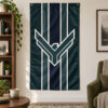 Dark teal and navy Atreides flag with white hawk design hanging vertically in a reading room