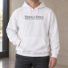 White Pierce and Pierce hoodie worn with grey trousers, showing the centered black chest print